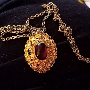 Necklace with Ruby colored Stone in center
